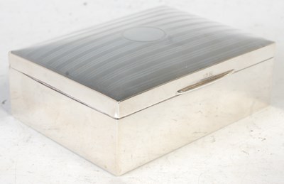 Lot 240 - A Birmingham silver cigarette box, the hinged...
