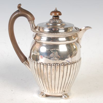 Lot 244 - A London silver hot water pot, engraved with...