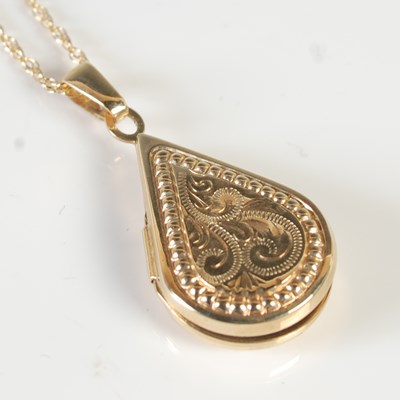 Lot 276 - A 9ct gold necklace suspending 9ct gold pear...