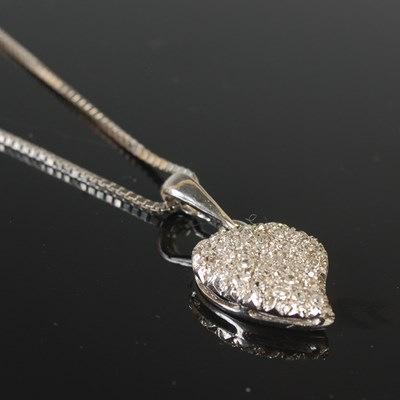 Lot 277 - An 18ct white gold necklace suspending a white...