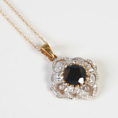 Lot 280 - A 9ct yellow and white gold gem set pendant...