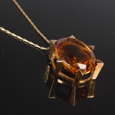 Lot 285 - A yellow metal mounted oval faceted citrine...