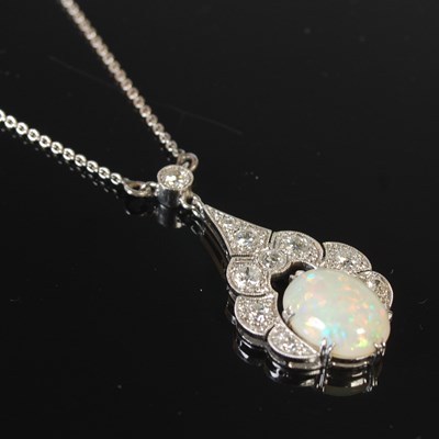 Lot 289 - An Art Deco style white metal opal and diamond...