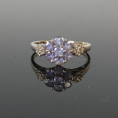 Lot 295 - A white metal diamond chip and coloured gem...
