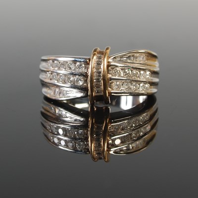Lot 296 - A 9ct white and yellow gold diamond set dress...