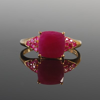 Lot 303 - A 9ct gold and ruby gem set dress ring,...