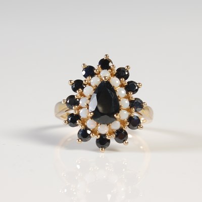 Lot 306 - A 9ct gold sapphire and opal cluster ring,...
