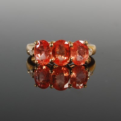 Lot 307 - An 18ct Ceylon Padparadscha Sapphire and...