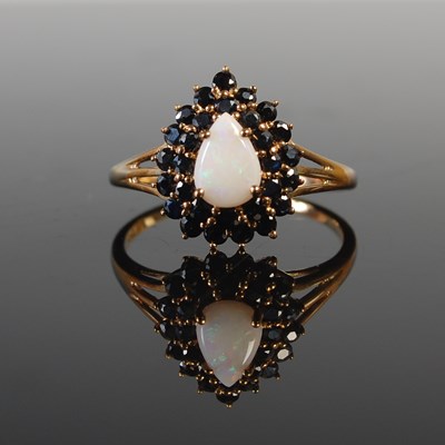 Lot 310 - A 9ct gold sapphire and opal cluster ring,...