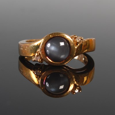 Lot 324 - A 9ct gold gem set dress ring, centred with...