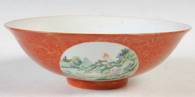 Lot 393 - A Chinese porcelain coral ground footed bowl,...