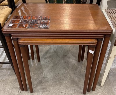 Lot 861 - A mid-century nest of three teak tables with...