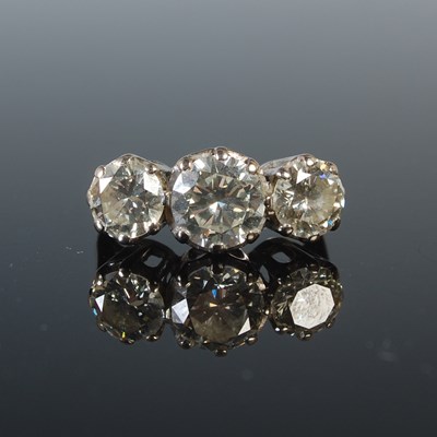 Lot 331 - A white metal and diamond three stone ring,...