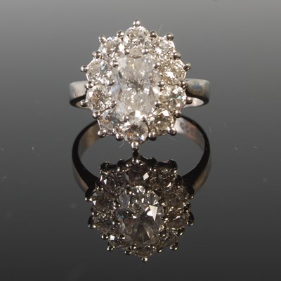 Lot 344 - A platinum and diamond set cluster ring,...