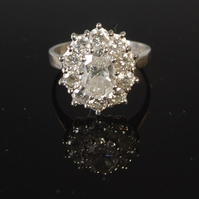 Lot 344 - A platinum and diamond set cluster ring,...