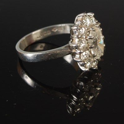 Lot 344 - A platinum and diamond set cluster ring,...