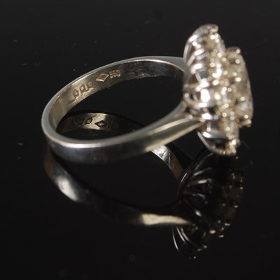 Lot 344 - A platinum and diamond set cluster ring,...