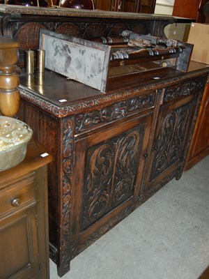 Lot 640 - A Victorian stained oak sideboard with upright...