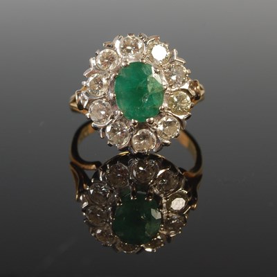 Lot 353 - A yellow and white metal emerald and diamond...