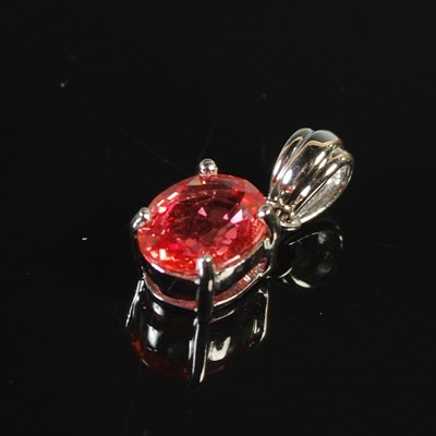 Lot 364 - An 18ct Ceylon Padparadscha Sapphire set...