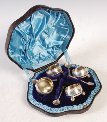 Lot 374 - A cased set of four Victorian silver salts and...