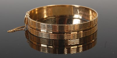 Lot 455 - A 9ct gold bangle, stamped 'MP', maker's mark...