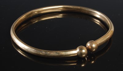 Lot 464 - A 9ct gold bangle, 6.7 grams.