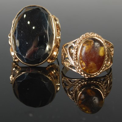Lot 470 - Two yellow metal single stone dress rings,...