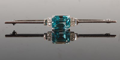 Lot 474 - A white metal blue zircon and diamond set bar...