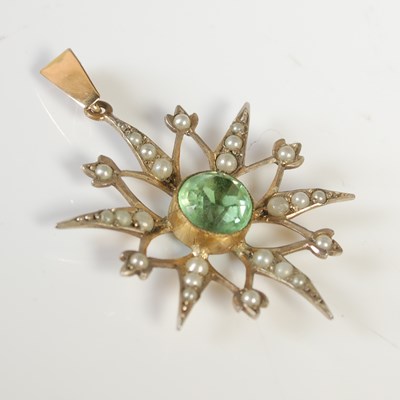 Lot 476 - A gold plated split pearl and green gemstone...