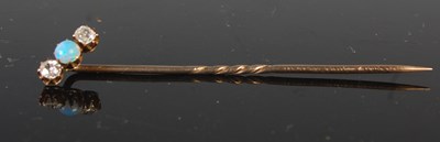 Lot 477 - A yellow metal opal and diamond stick pin,...