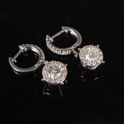 Lot 436 - A pair of white metal and diamond set earrings,...
