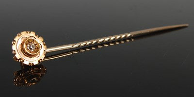 Lot 441 - A yellow metal and diamond set stick pin,...
