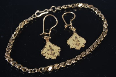 Lot 448 - A yellow metal bracelet, stamped '585', tests...