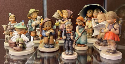 Lot 523 - A collection of ten assorted Hummel figures