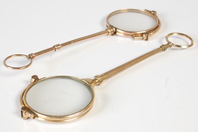 Lot 502 - Two gold plated lorgnettes, the largest 14cm...