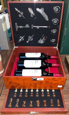 Lot 558 - A presentation chess board wine box containing...