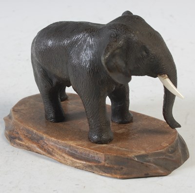 Lot 569 - A small Japanese bronze figure of an elephant...
