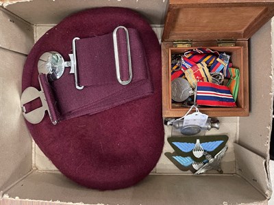 Lot 574 - A small collection of militaria, to include...