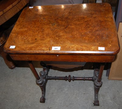 Lot 691 - A Victorian walnut and boxwood lined work table