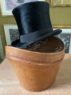 Lot 680 - A leather top hat box containing vintage top hat
