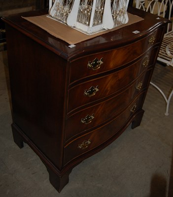 Lot 694 - A reproduction mahogany serpentine chest of...