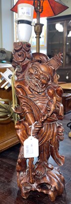 Lot 643 - A Chinese carved wood figural table lamp, with...