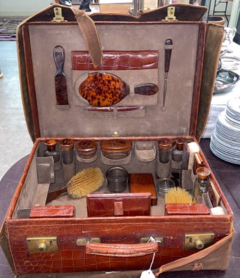 Lot 648 - Asprey, London, a brown leather simulated...