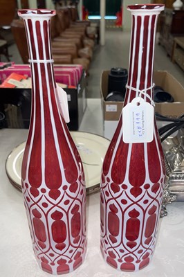 Lot 666A - A pair of opaque white overlaid ruby glass...