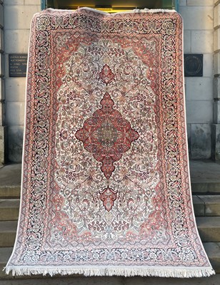 Lot 920 - A Kaschan Seide carpet, the rectangular ivory...
