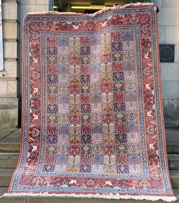 Lot 923 - A Persian Moud carpet, the rectangular field...