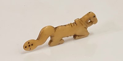 Lot 266C - An antique bone snuff spoon carved in the form...