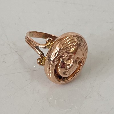 Lot 291G - A yellow metal friendship ring, with oval mask...