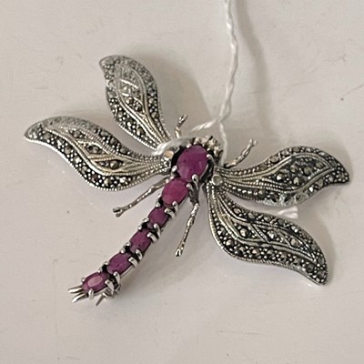 Lot 291L - A white metal marcasite and ruby coloured gem...